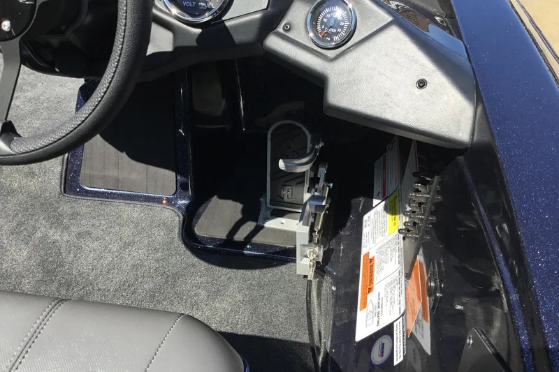 Slide: The Image of 2024 Skeeter ZX 150 boat dashboard with steering wheel and control panel. - 10