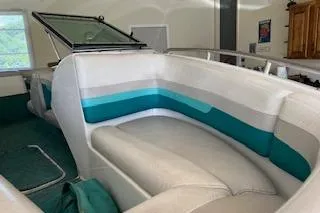Slide: The Image of 1994 Chris-Craft 185 Concept boat interior with teal and white seating. - 3