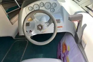 Slide: The Image of 1994 Chris-Craft 185 Concept boat dashboard with steering wheel and gauges. - 4
