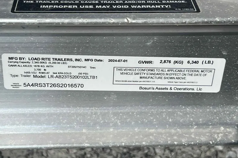 Slide: The Image of Label on Load Rite trailer for 2024 Boston Whaler 220 Dauntless, showing specifications and compliance. - 14