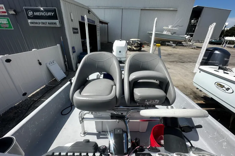 Slide: The Image of 2022 Haynie 25 Magnum boat interior with dual gray seats at Emerald Coast Marine. - 6