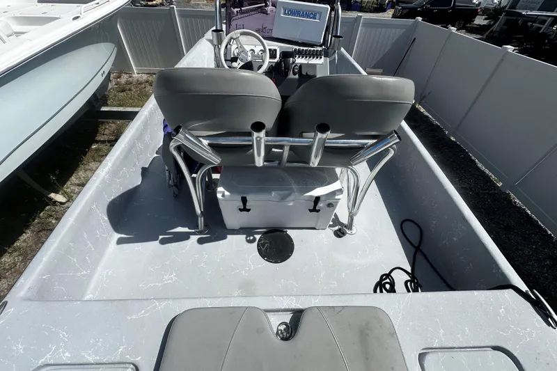 Slide: The Image of 2022 Haynie 25 Magnum boat interior with dual seats and navigation equipment. - 8