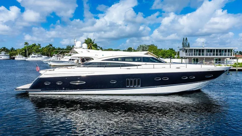 Slide: The Image of Luxury 2010 Princess V78 yacht on a sunny day, cruising in calm waters. - 10