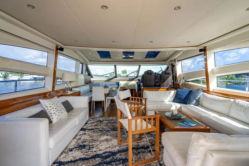 Slide: The Image of Luxurious interior of 2010 Princess V78 yacht with elegant seating and panoramic windows. - 19