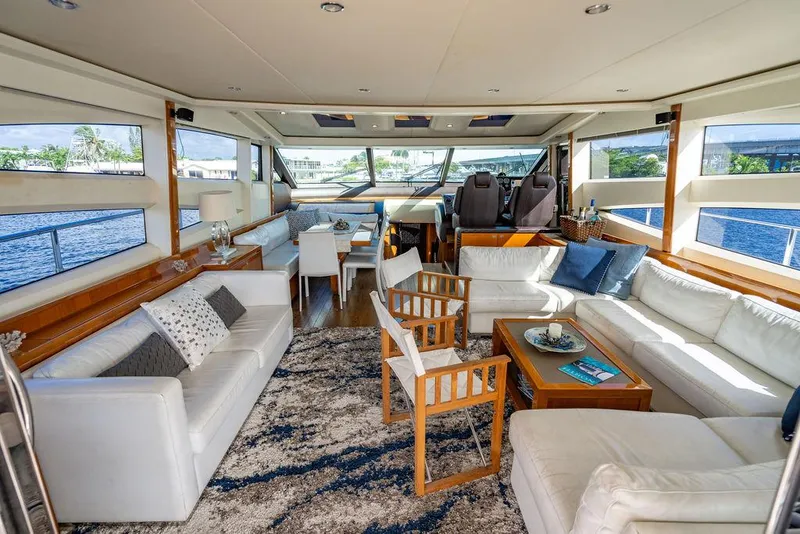 Slide: The Image of Luxurious interior of 2010 Princess V78 yacht with elegant seating and panoramic windows. - 20