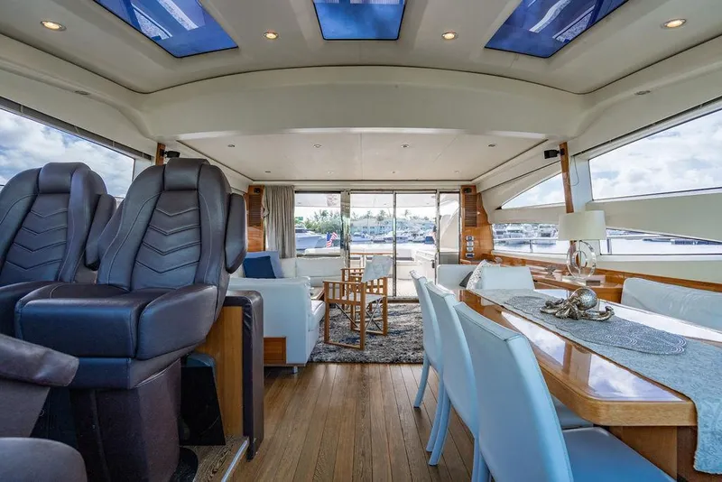 Slide: The Image of Luxurious interior of 2010 Princess V78 yacht with elegant seating and dining area. - 32