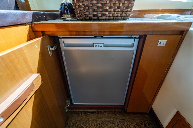 Slide: The Image of Compact kitchen area on 2010 Princess V78 yacht with built-in fridge. - 36