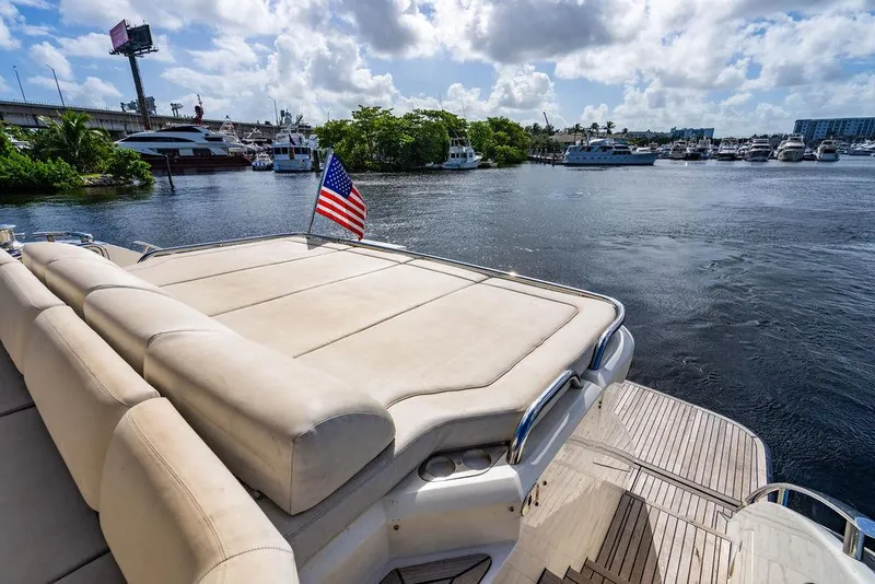 Slide: The Image of Luxury 2010 Princess V78 yacht with American flag, docked in a marina. - 39
