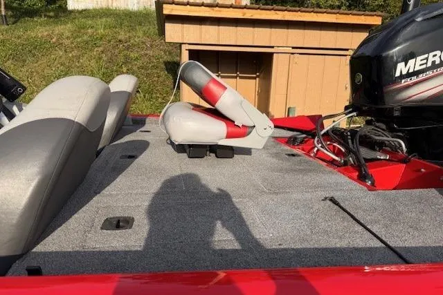 Slide: The Image of 2015 Tracker Pro Team 175TXW boat deck with seating and Mercury engine. - 12