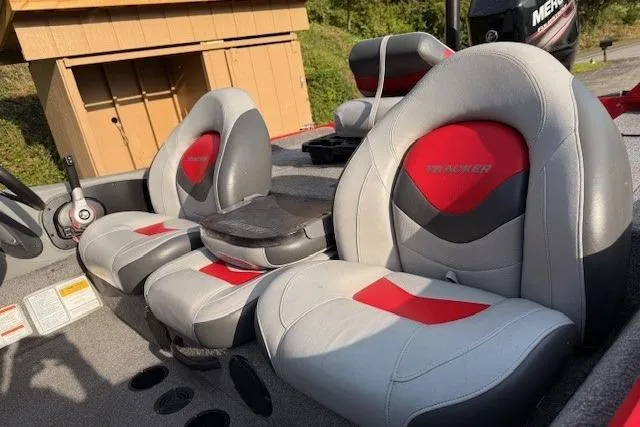 Slide: The Image of 2015 Tracker Pro Team 175TXW boat seats with red and gray upholstery. - 13
