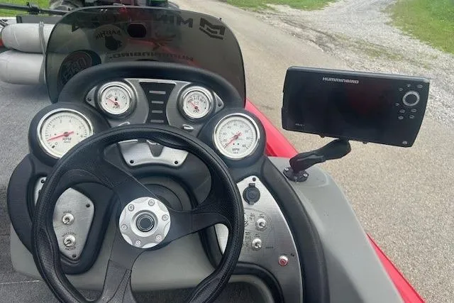 Slide: The Image of Dashboard of 2015 Tracker Pro Team 175TXW boat with steering wheel and gauges. - 3