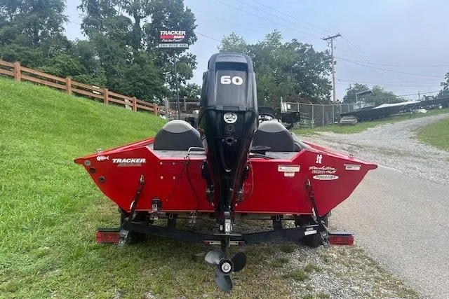 Slide: The Image of 2015 Tracker Pro Team 175TXW boat, red, rear view with 60 HP motor. - 8