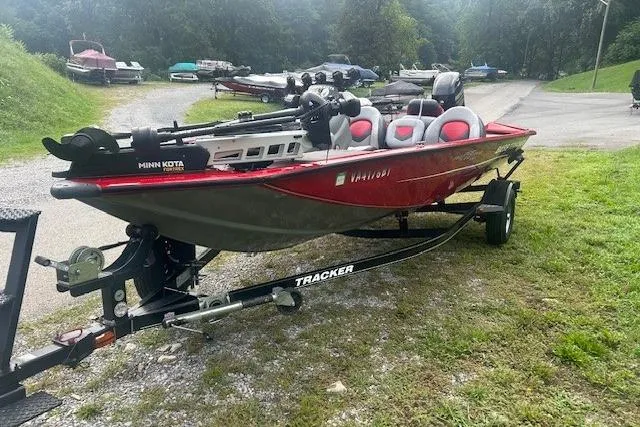 Slide: The Image of 2015 Tracker Pro Team 175TXW fishing boat on trailer, parked outdoors. - 9