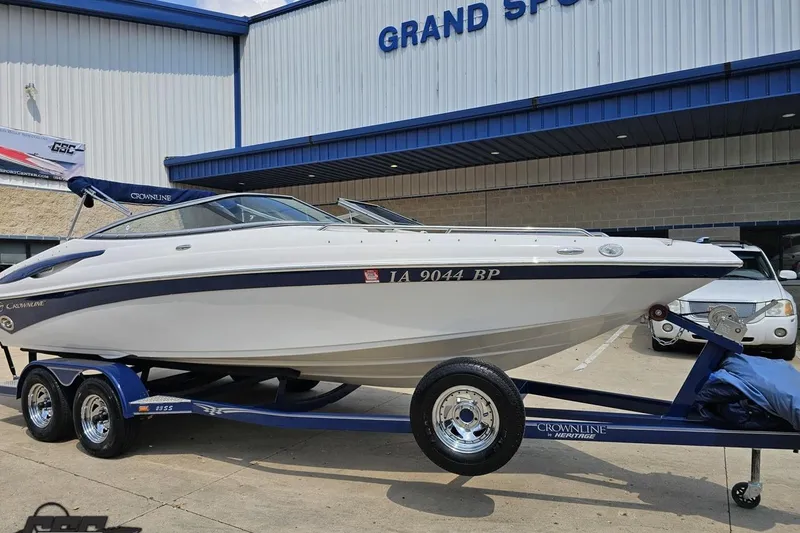 Slide: The Image of 2007 Crownline 23 SS boat on trailer outside Grand Sport Center. - 13