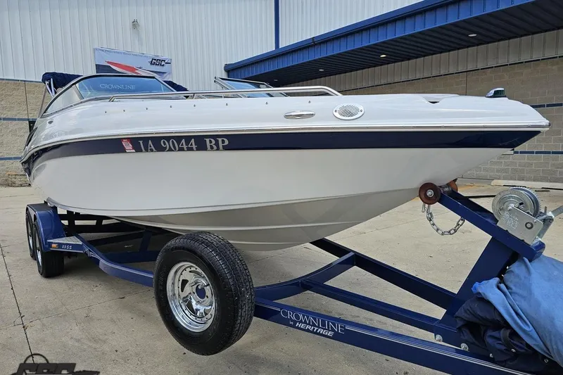 Slide: The Image of 2007 Crownline 23 SS boat on trailer, parked outside a building. - 14