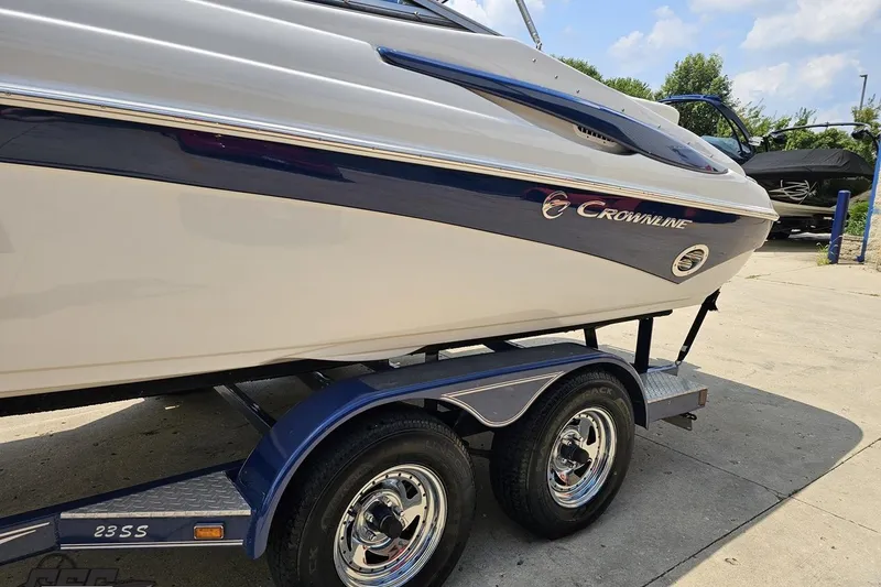 Slide: The Image of 2007 Crownline 23 SS boat on trailer, showcasing sleek design and branding. - 20