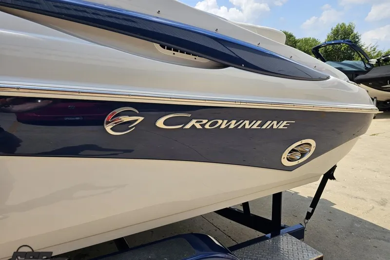 Slide: The Image of 2007 Crownline 23 SS boat side view with logo and sleek design. - 21