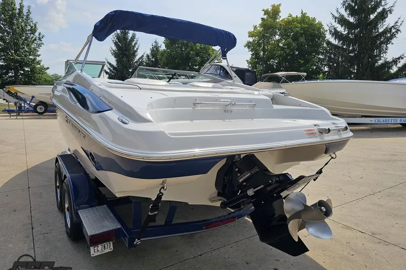 Slide: The Image of 2007 Crownline 23 SS boat on trailer, rear view, outdoors, sunny day. - 27