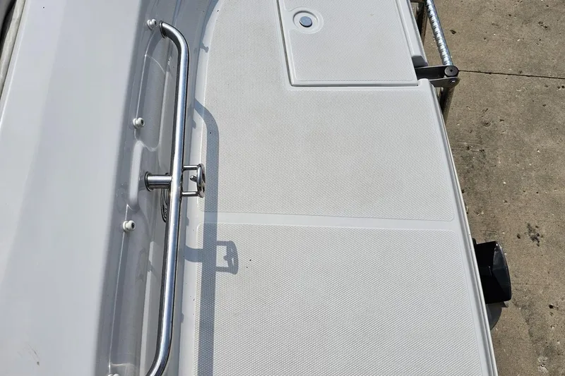 Slide: The Image of 2007 Crownline 23 SS boat deck with stainless steel railing and textured surface. - 36