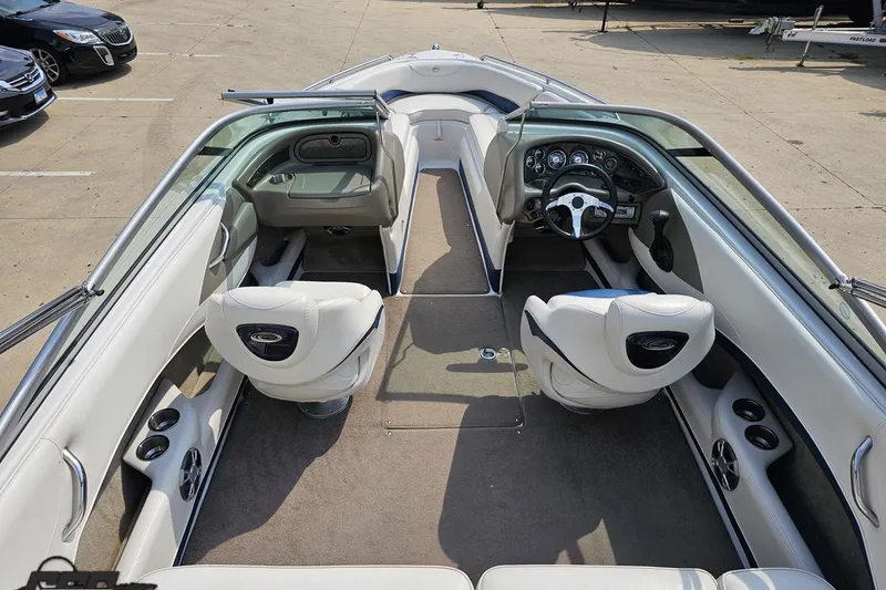 Slide: The Image of 2007 Crownline 23 SS boat interior with white seating and modern dashboard. - 39
