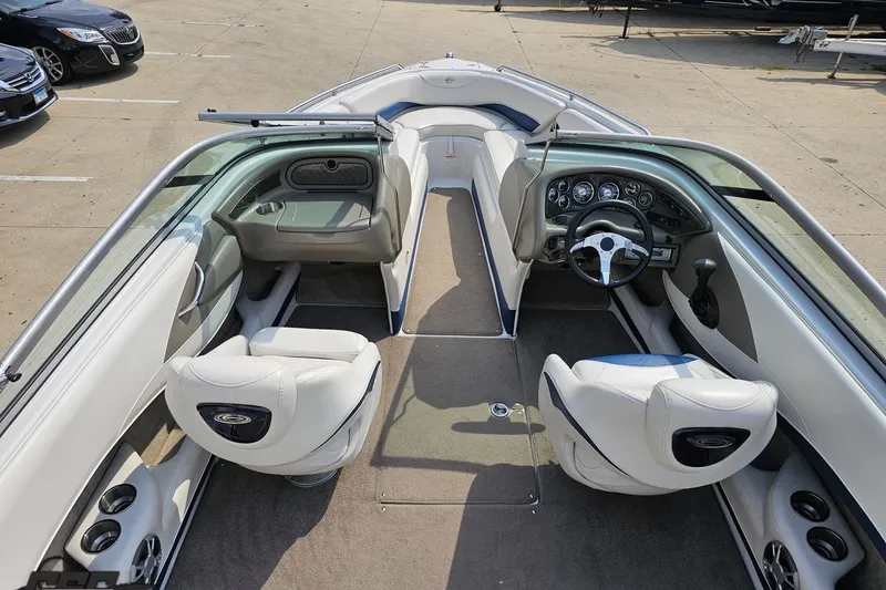 Slide: The Image of 2007 Crownline 23 SS boat interior with white seating and dashboard view. - 40