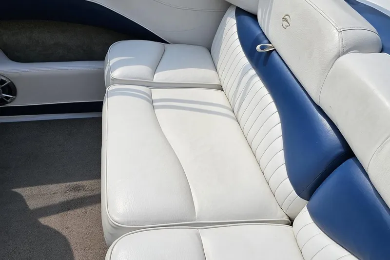 Slide: The Image of 2007 Crownline 23 SS boat interior with white and blue leather seating. - 41