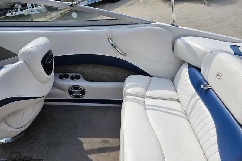 Slide: The Image of Interior of 2007 Crownline 23 SS boat with white and blue seating. - 42