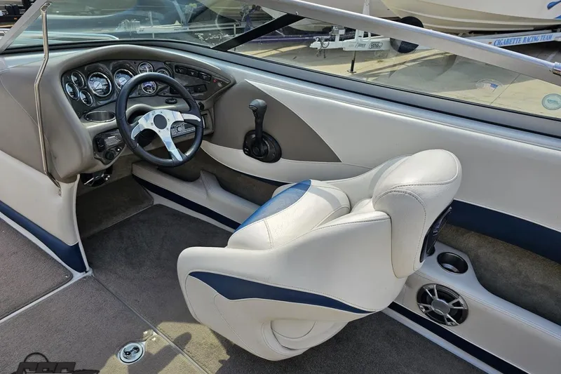 Slide: The Image of 2007 Crownline 23 SS boat interior with steering wheel and dashboard controls. - 43