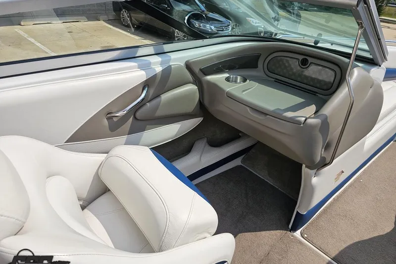 Slide: The Image of Interior of a 2007 Crownline 23 SS boat with white and gray seating. - 46