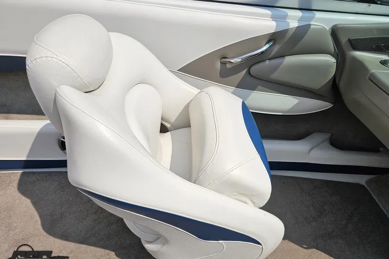 Slide: The Image of 2007 Crownline 23 SS boat interior with white and blue seating, showcasing luxury design. - 47