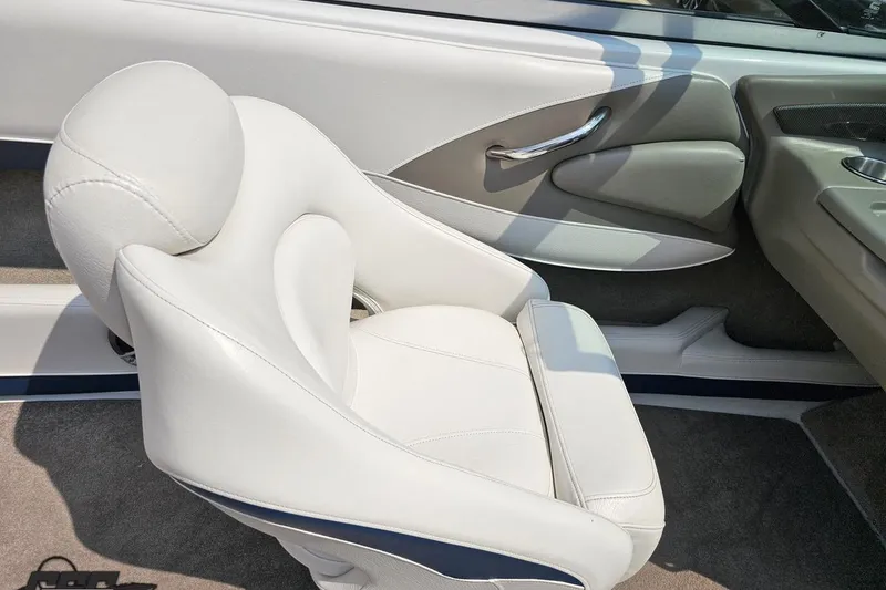 Slide: The Image of 2007 Crownline 23 SS boat interior with white leather seating and sleek design. - 48