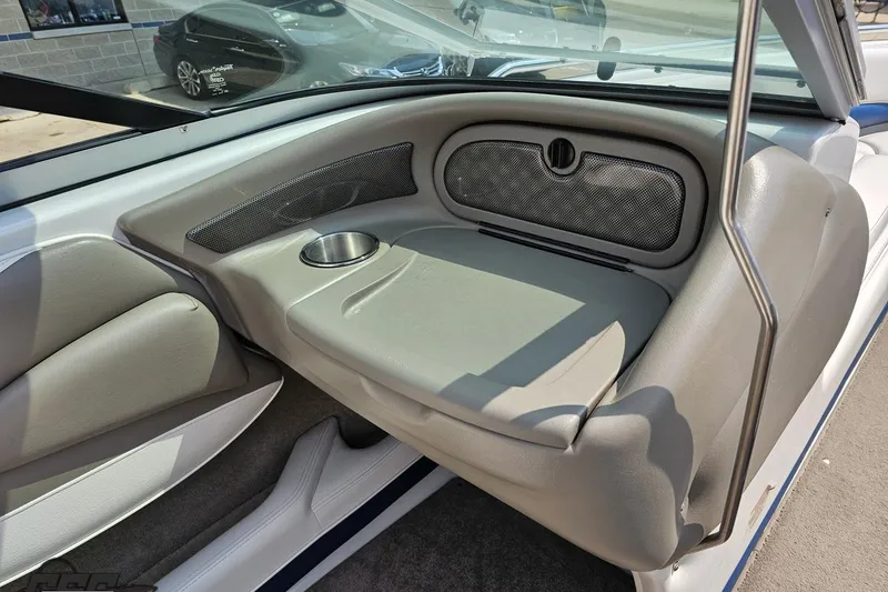 Slide: The Image of 2007 Crownline 23 SS boat interior with cup holder and cushioned seating. - 49