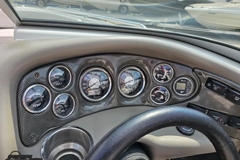 Slide: The Image of Dashboard of a 2007 Crownline 23 SS boat with various gauges and controls. - 57