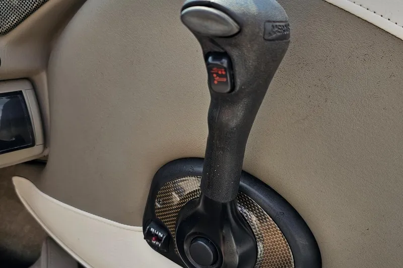 Slide: The Image of Throttle control lever of a 2007 Crownline 23 SS boat, featuring ergonomic design. - 59