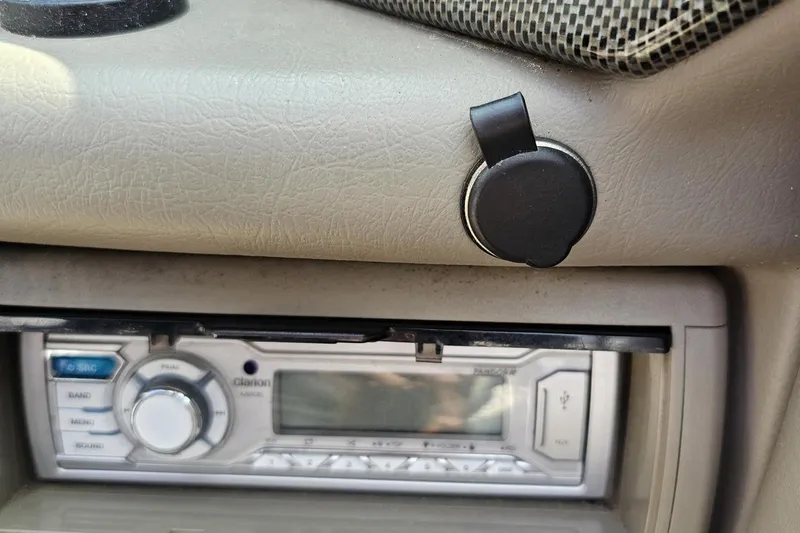 Slide: The Image of 2007 Crownline 23 SS dashboard with Clarion stereo system and accessory port. - 60
