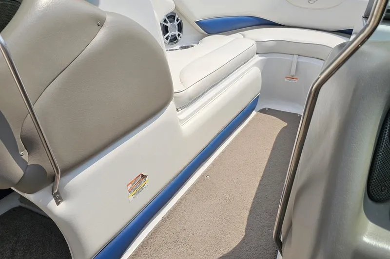 Slide: The Image of 2007 Crownline 23 SS boat interior with beige and blue seating, carpeted floor. - 61