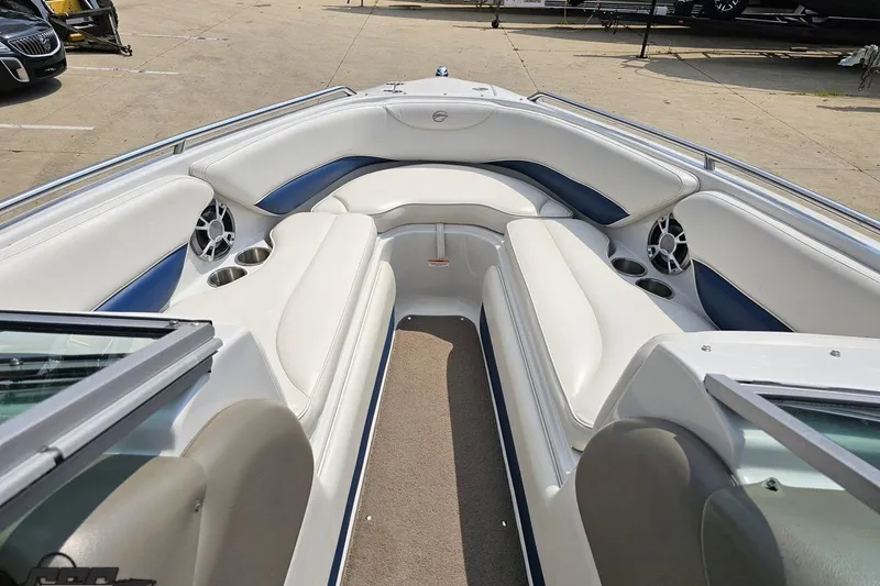 Slide: The Image of 2007 Crownline 23 SS boat interior with white seating and cup holders. - 62