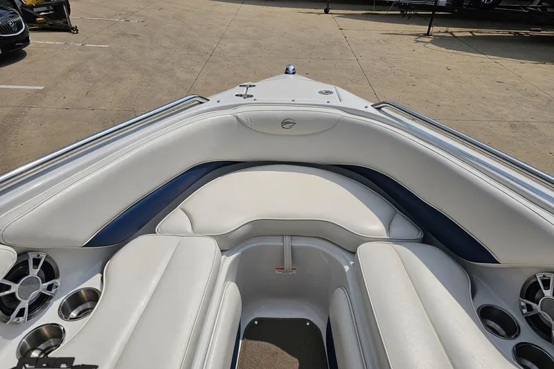 Slide: The Image of 2007 Crownline 23 SS boat interior with white seating and cup holders. - 64