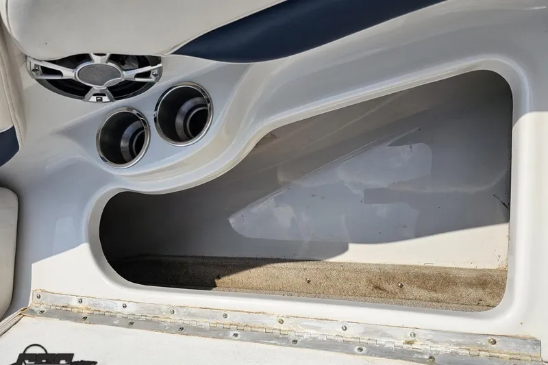 Slide: The Image of Interior view of a 2007 Crownline 23 SS boat, featuring cup holders and speaker. - 68