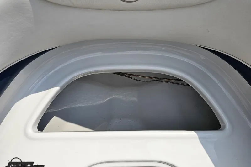 Slide: The Image of 2007 Crownline 23 SS boat storage compartment, white interior, open hatch. - 72
