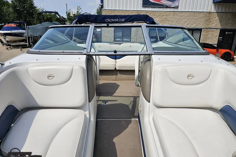 Slide: The Image of 2007 Crownline 23 SS boat interior with white seating and open deck view. - 74
