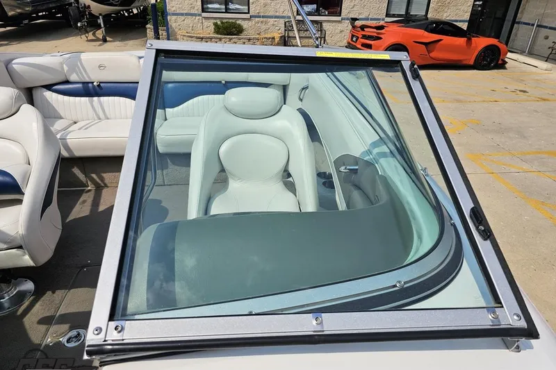 Slide: The Image of 2007 Crownline 23 SS boat interior with white seating and windshield view. - 76