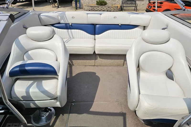 Slide: The Image of 2007 Crownline 23 SS boat interior with white and blue seating arrangement. - 77