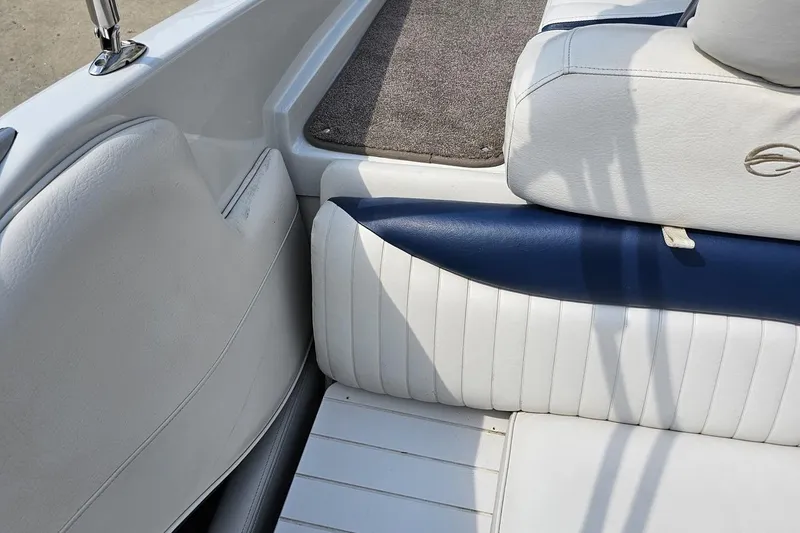 Slide: The Image of 2007 Crownline 23 SS boat interior with white and blue seating. - 80