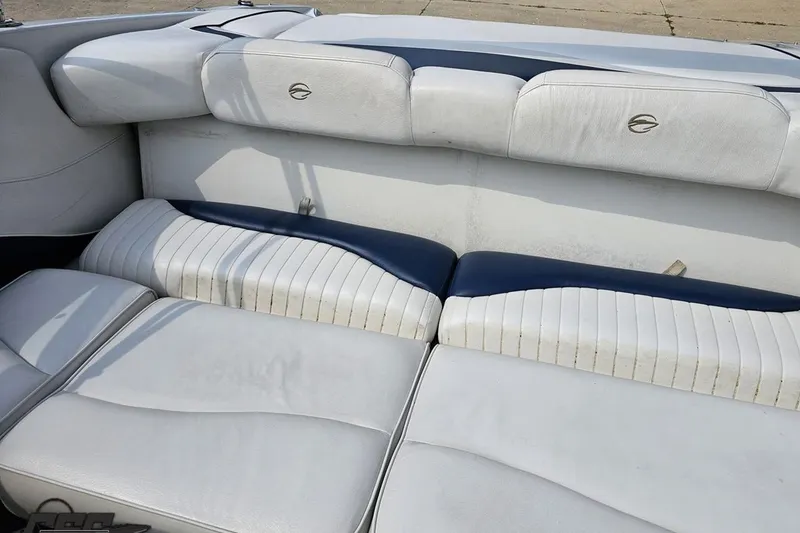 Slide: The Image of 2007 Crownline 23 SS boat interior with white and blue cushioned seating. - 81