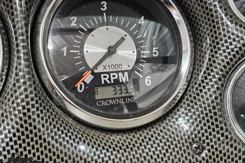 Slide: The Image of Tachometer of 2007 Crownline 23 SS boat showing 333.5 hours, carbon fiber dashboard. - 83