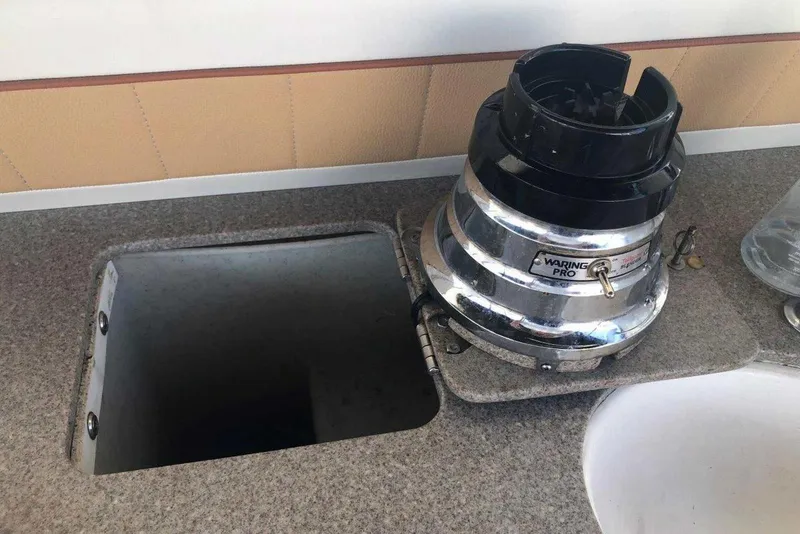 Slide: The Image of 2006 Rinker 342 Express Cruiser kitchen with built-in Waring Pro blender on countertop. - 12