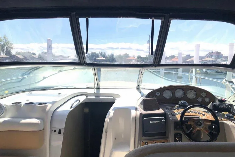 Slide: The Image of 2006 Rinker 342 Express Cruiser cockpit with steering wheel and instrument panel. - 15