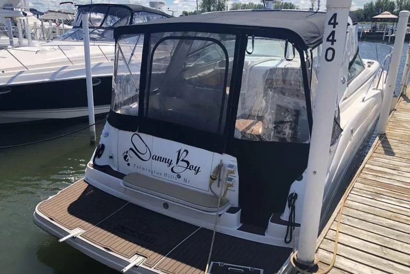 Slide: The Image of 2006 Rinker 342 Express Cruiser docked, featuring "Danny Boy" on the stern. - 4