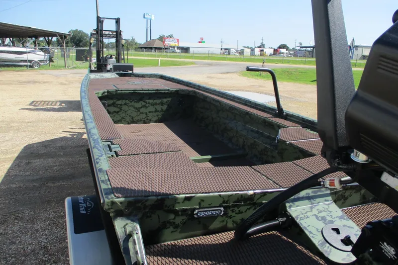 Slide: The Image of 2026 Gator Tail 1854 Extreme boat with camouflage design, parked outdoors. - 11